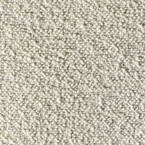 Close-up of off-white fabric with looped pile texture.