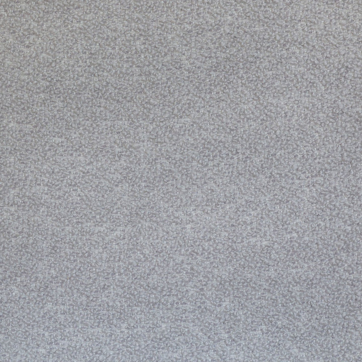 Close-up of a looped fabric weave in neutral color.