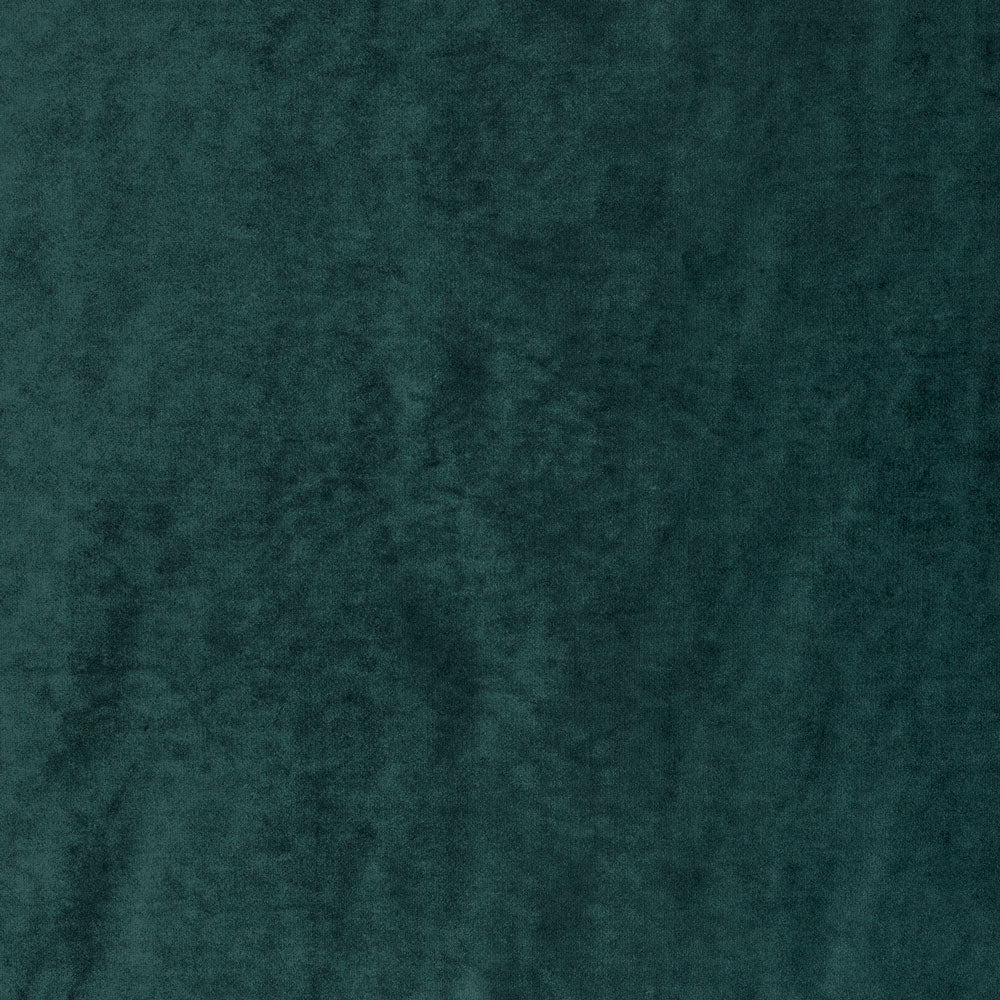 Close-up of a deep green plush fabric with soft texture.