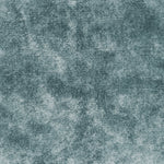 Close-up photo of a plush blue-grey fabric with mottled texture.
