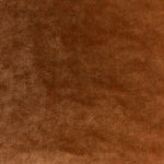 Textured brown surface with varying shades, resembling fabric or leather.