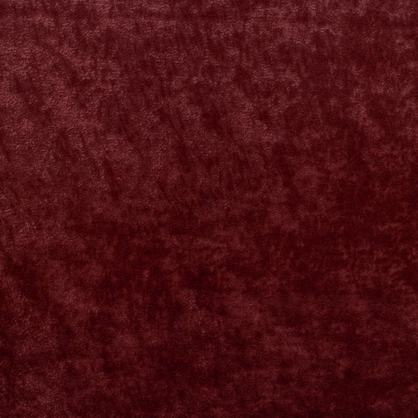 Close-up of plush red fabric showcases its rich texture.