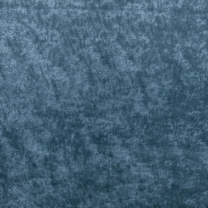 Close-up view of deep blue plush fabric with textured surface.