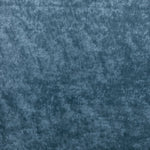 Close-up view of deep blue plush fabric with textured surface.