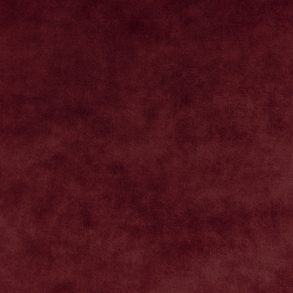 Close-up of plush burgundy fabric with velvety texture and variations.