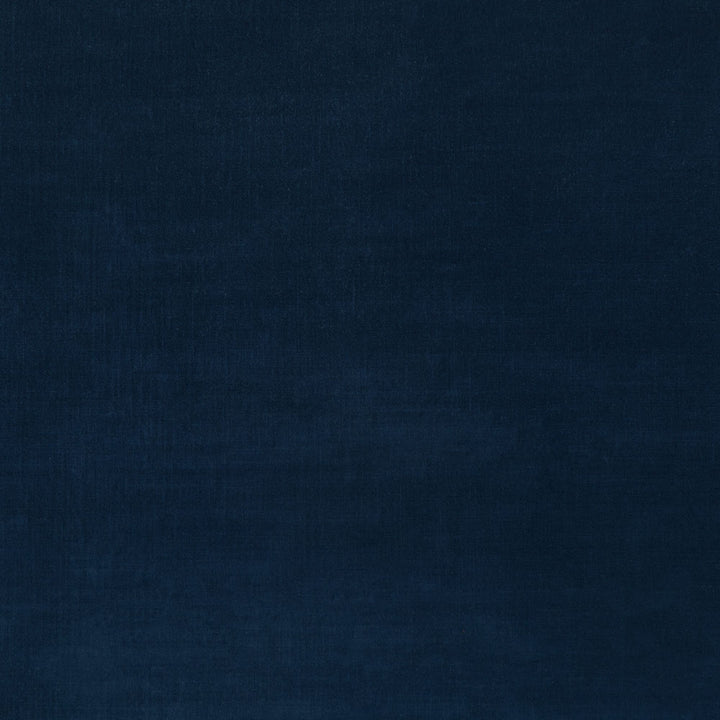 Close-up of deep blue textured fabric, possibly denim or canvas.