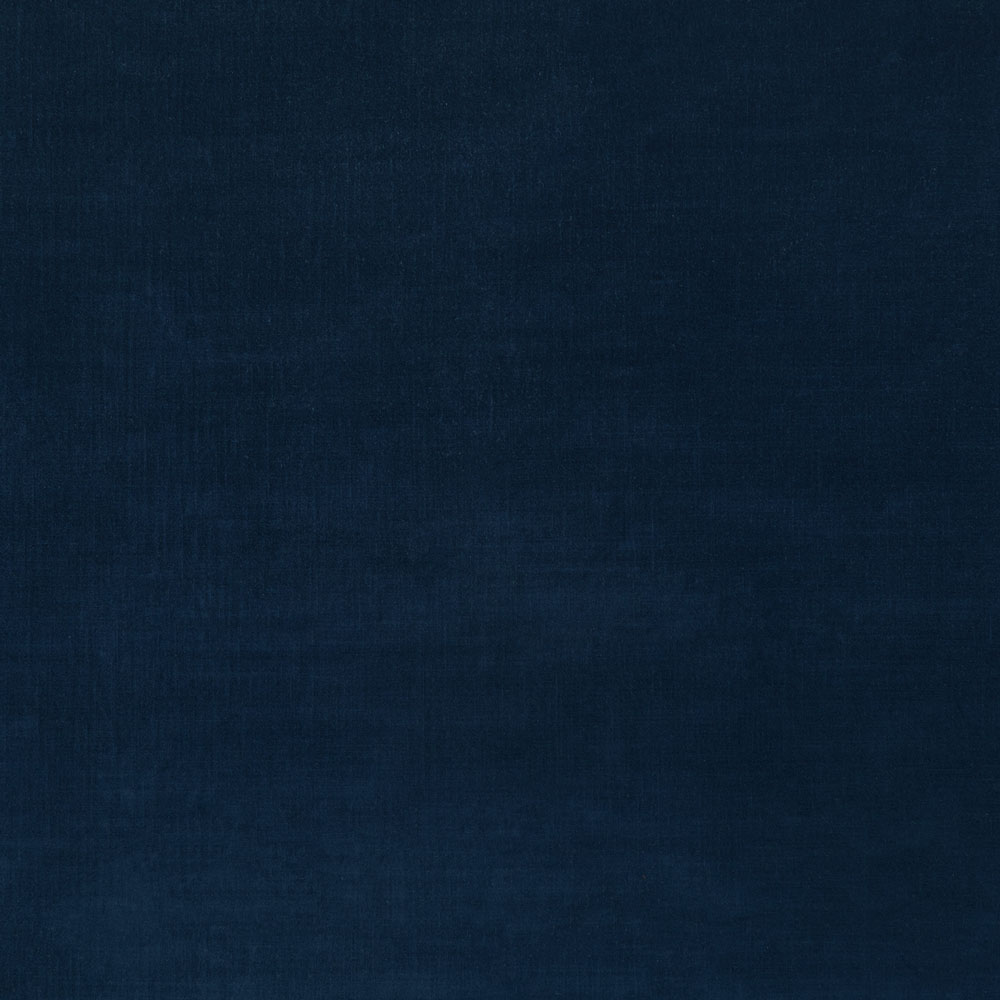 Close-up of deep blue textured fabric, possibly denim or canvas.