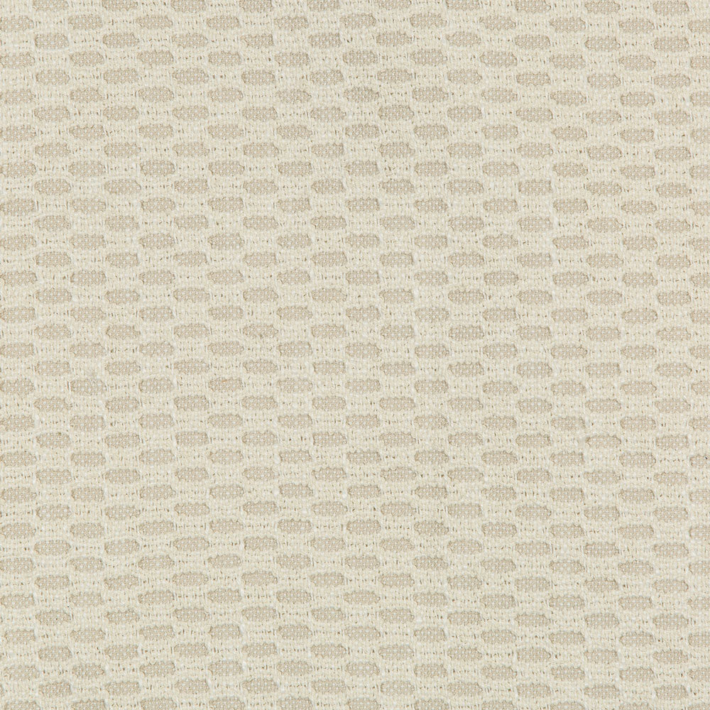 Close-up of textured fabric with woven oval-like patterns in neutral beige.