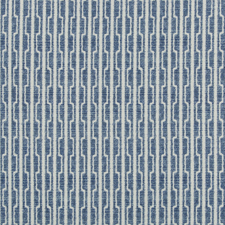 Close-up of fabric with textured geometric pattern in blue and white.