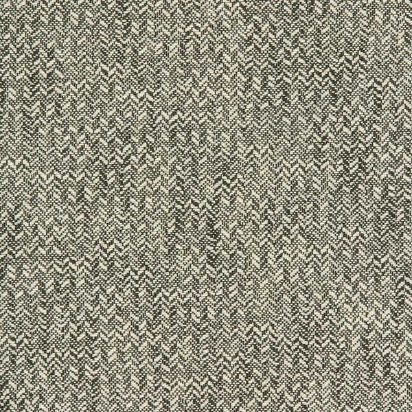 Close-up of herringbone pattern fabric with contrasting light and dark threads.