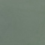 Close-up photograph of a teal textured fabric or carpet surface.