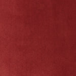 Close-up of vibrant red woven fabric with subtle mottled texture.