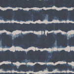 Hand-dyed navy and white fabric with organic, striped pattern.