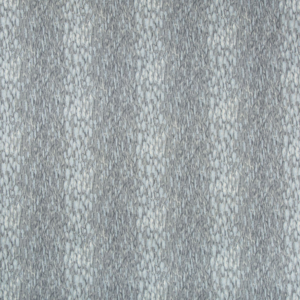 Close-up of a textured surface with small, speckled pebble-like elements.