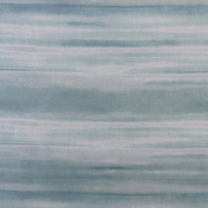 Soft blue and white striped fabric evokes a tranquil ambiance.
