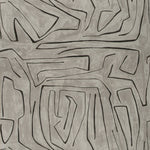 Abstract grayscale artwork featuring interlocking shapes and labyrinthine patterns.
