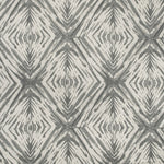 Monochromatic geometric pattern with tribal aesthetic creates an organic design.