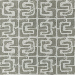 Repeating geometric pattern with interlocking shapes in contrasting colors.