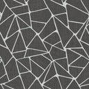 Geometric patterned fabric with irregularly shaped polygons in contrasting colors.