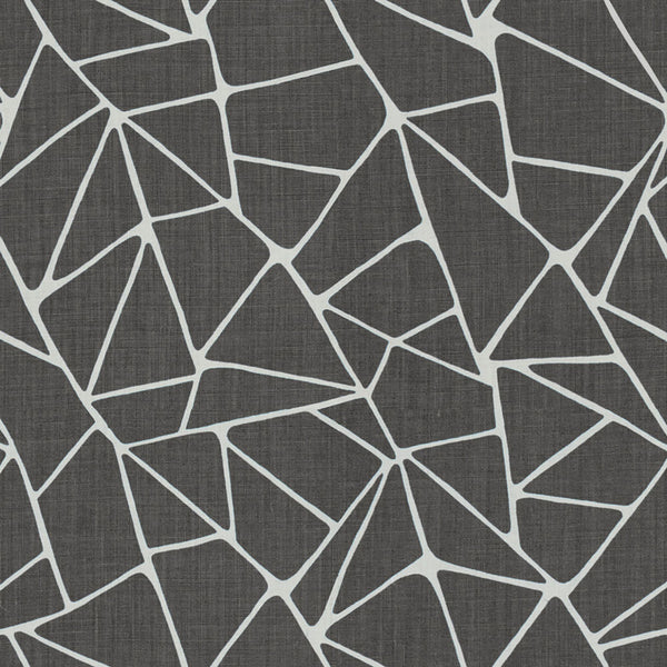 Geometric patterned fabric with irregularly shaped polygons in contrasting colors.