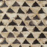 An abstract tessellation featuring triangles and diamonds in textured colors.