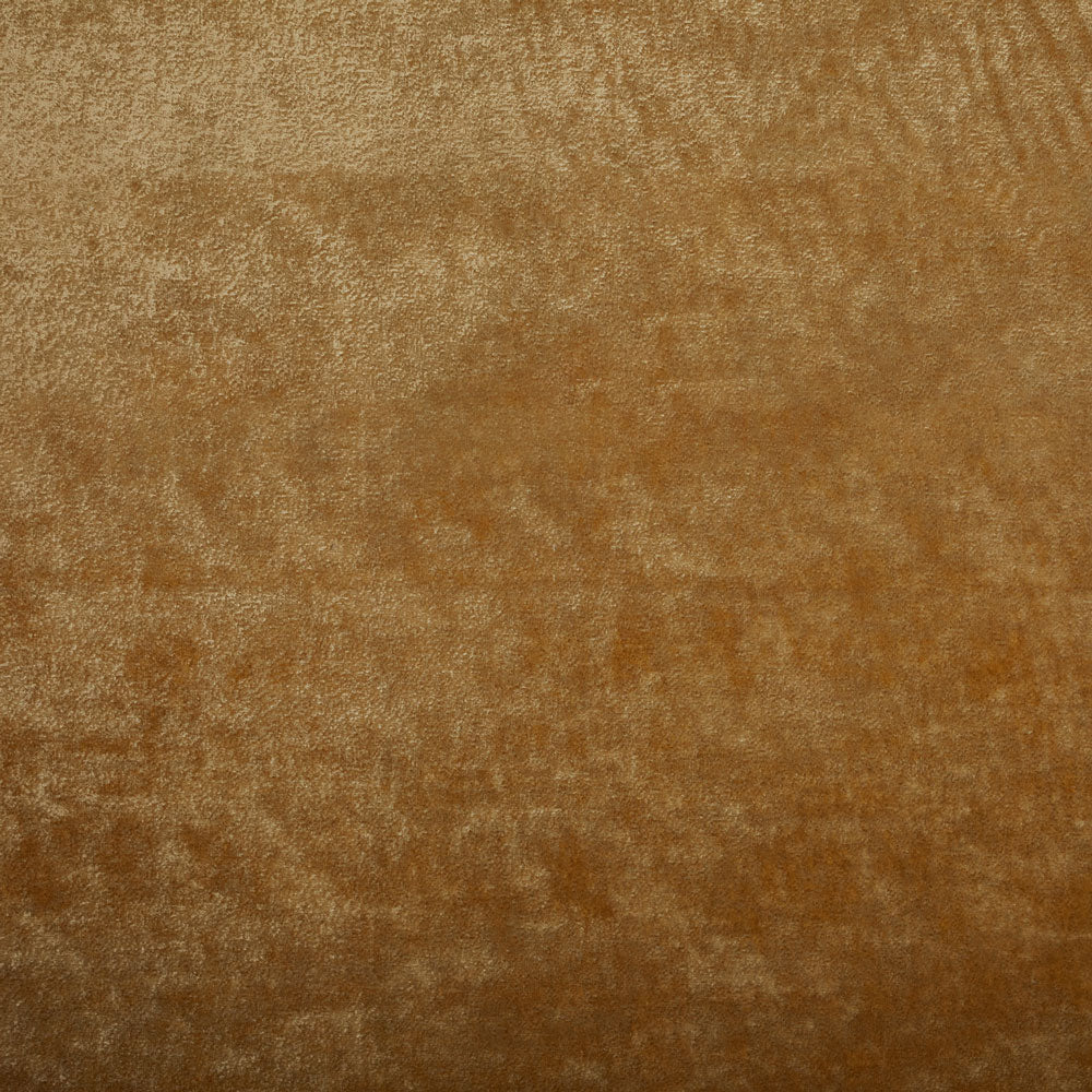 Close-up of a velvety textured surface with a warm gradient.
