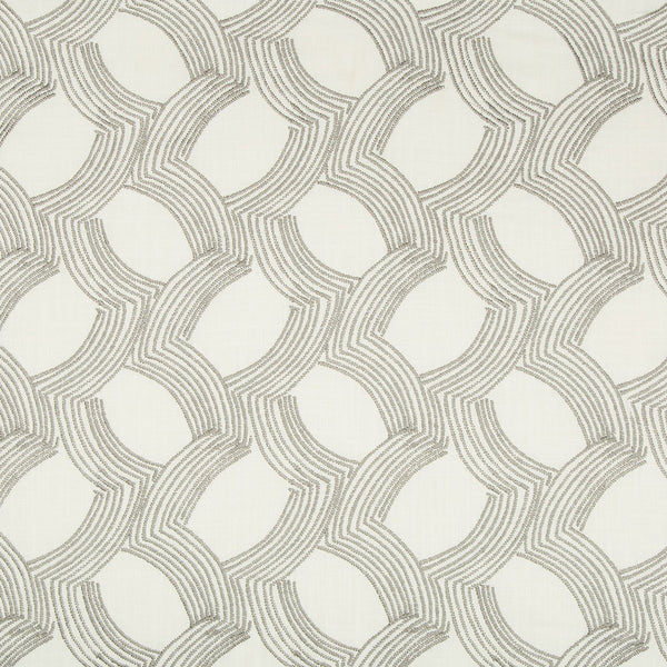 Repetitive geometric pattern with interlocking curves, creating a textured textile.