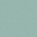 Minimalist light teal fabric background with uniform, textured pattern.