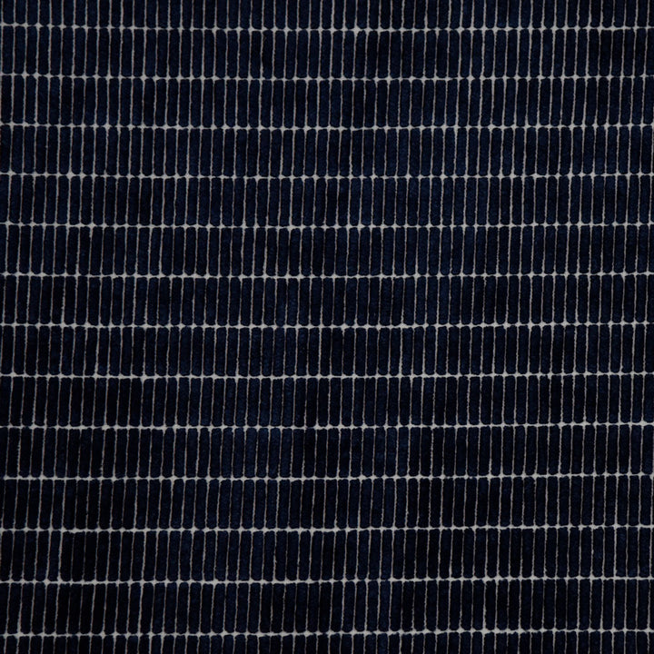Close-up of denim fabric, showcasing twill weave and ribbing effect.