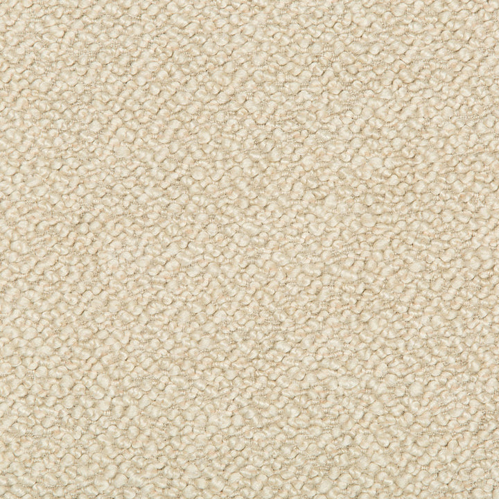 Close-up view of a beige carpet with uniform loop pile texture.