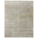 Vintage-inspired rug with muted beige tones and faded geometric pattern.