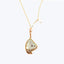 Delicate gold-tone pendant necklace with translucent pearlescent stone centerpiece.