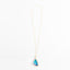 Elegant gold necklace with a stunning blue gemstone pendant