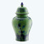 Green porcelain vase with blue floral patterns and lid detail