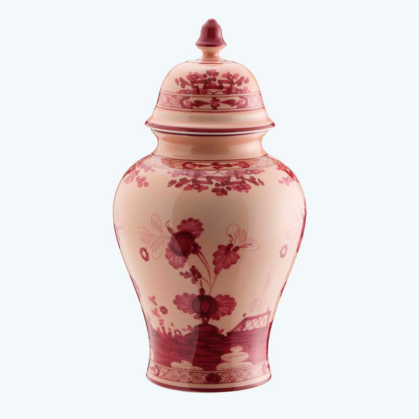 Exquisite porcelain vase with intricate red patterns and floral motifs