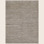 Modern geometric rug with three-dimensional cube illusion in neutral tones.