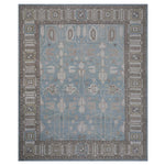 Exquisite symmetrical area rug with intricate patterns and muted tones.