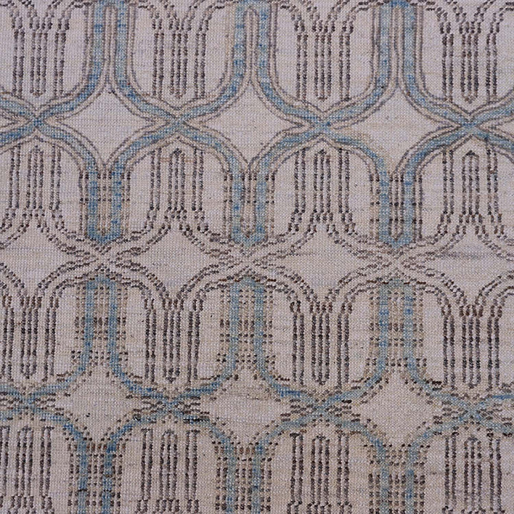 Close-up of intricate, symmetrical fabric design in neutral tones.