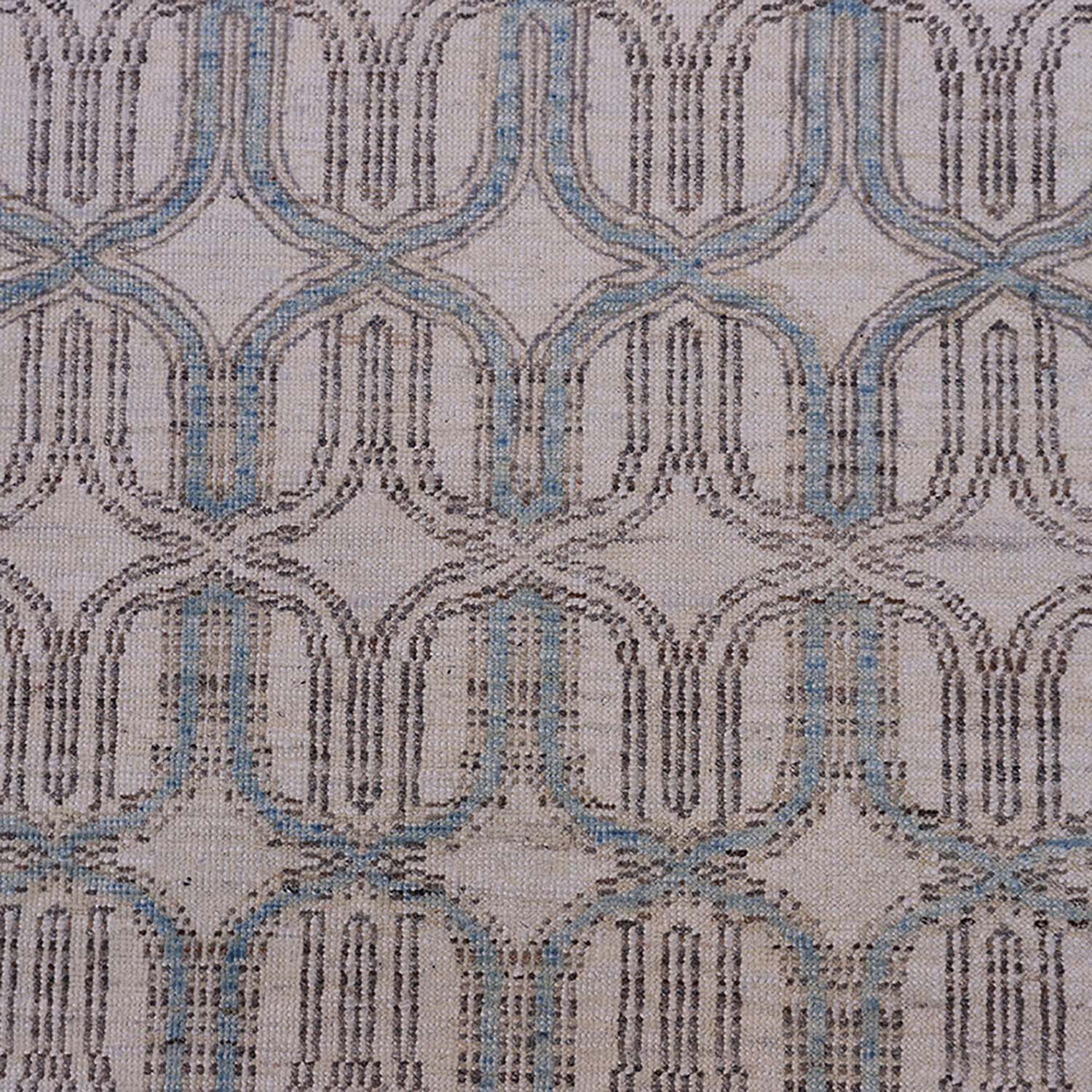 Close-up of intricate, symmetrical fabric design in neutral tones.