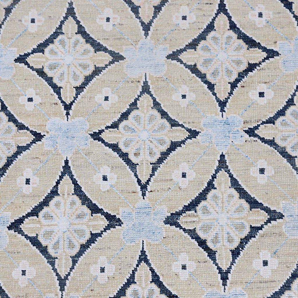 Close-up of intricate, symmetrical fabric pattern in blue and gray.