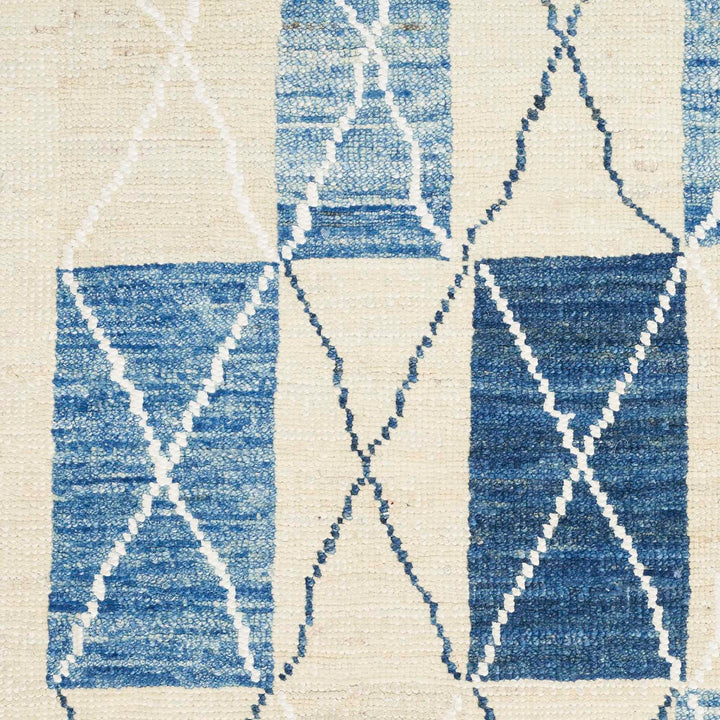 Textured blue fabric with geometric pattern adds depth and dimension.