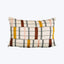 Rectangular throw pillow with colorful grid pattern, adding decorative style.