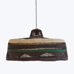 Handcrafted natural fiber pendant lamp with intricate woven design.
