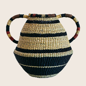 Handcrafted woven basket with precision stripes and decorative handle.