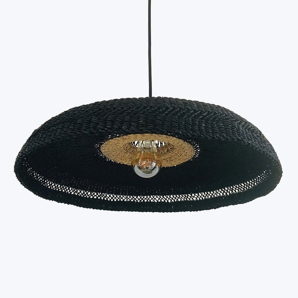 Distinctive pendant light with woven black shade and golden accents.