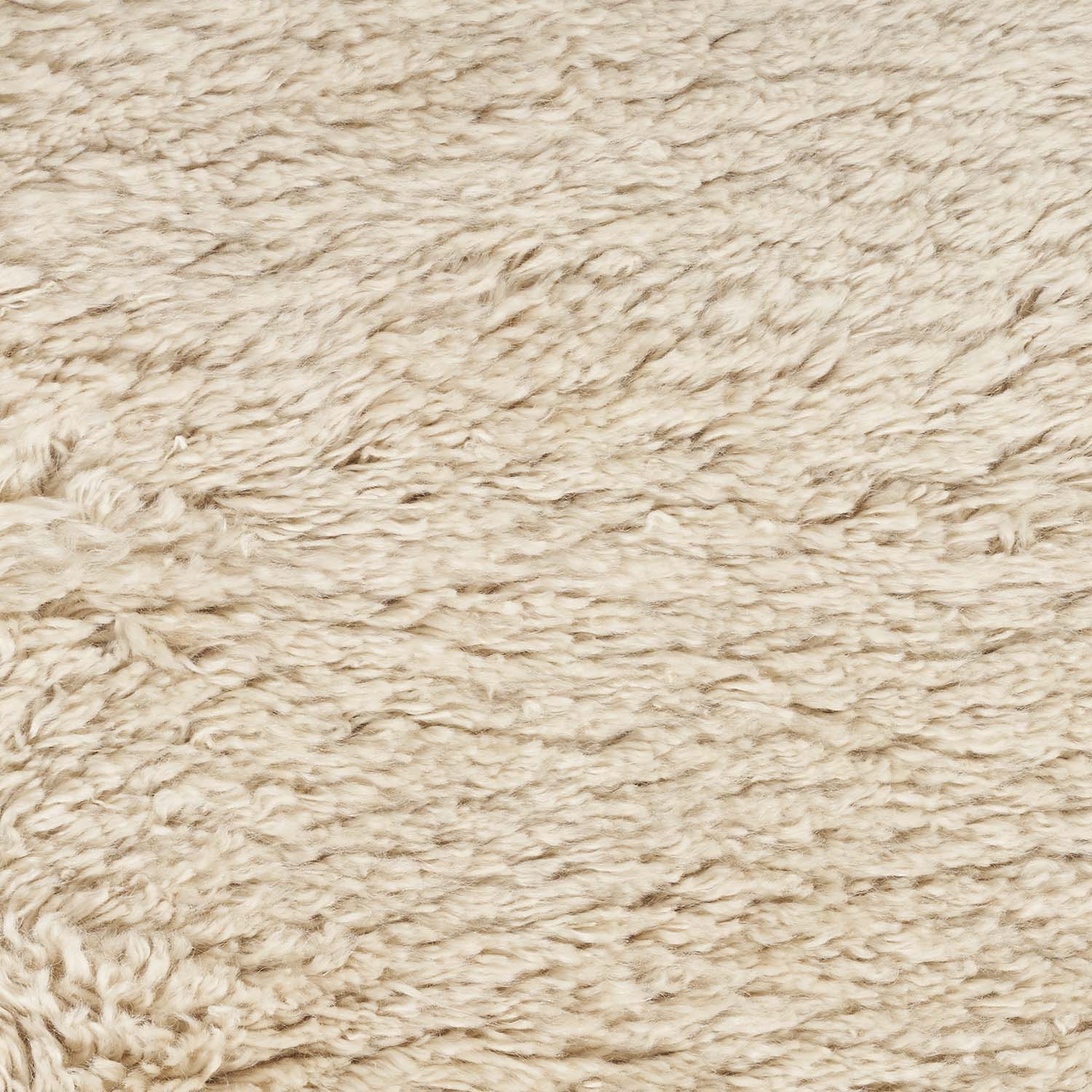 Close-up of fluffy, fibrous material resembling sheepskin or faux fur.