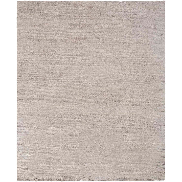 Soft and fluffy rectangular rug in a uniform light color.