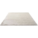 Simple, plain rug with soft texture in uniform light color.