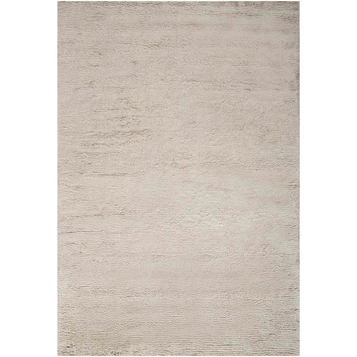 Minimalist and versatile rectangular rug with a plush, textured surface.