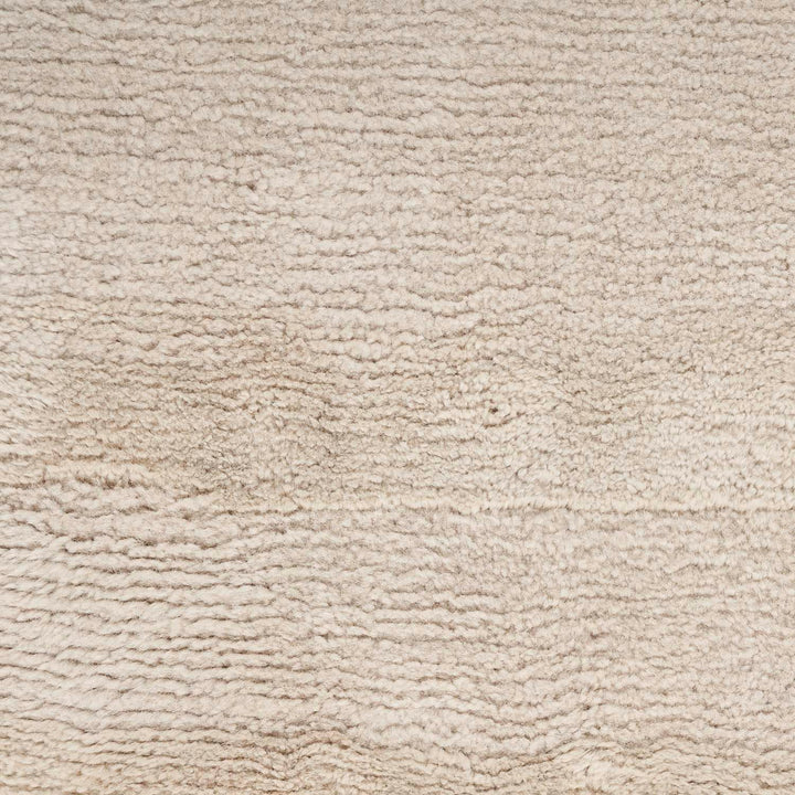 Close-up of cream textured surface with soft, fibrous consistency.